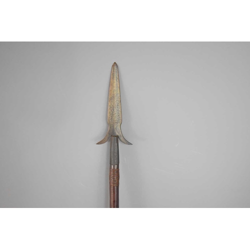 388 - A Gayang battle spear, Ifugao province, Luzon, the steel point with crescent-shaped barbs, 145cm.