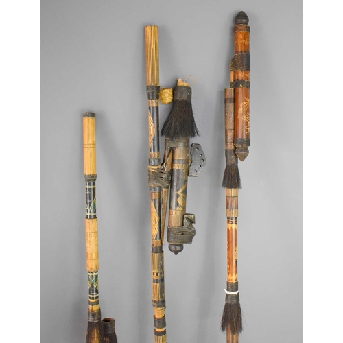 412 - Three tribal decorative bamboo blowguns, possibly Papua New Guinea together with three poison dart h... 