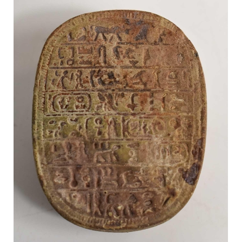 415 - An antique Egyptian stone carved scarab beetle, the base carved with six lines of hieroglyphs, 4cm b... 