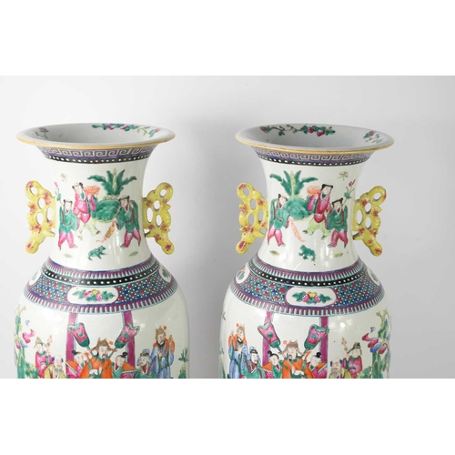 42 - A pair of 20th century Chinese floor vases, painted with warriors, flowers and insects with yellow d... 