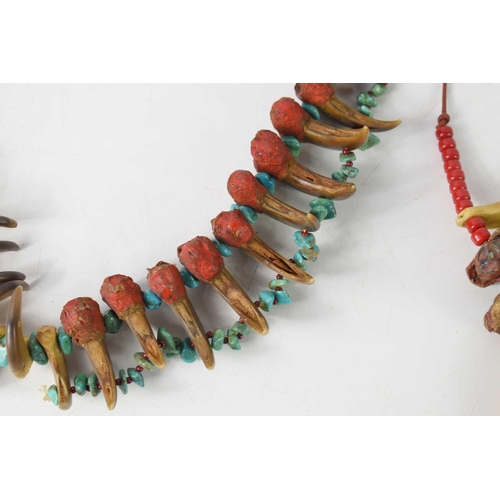 421 - A Native American claw and turquoise necklace, 20th century, the necklace with thirty claws and turq... 