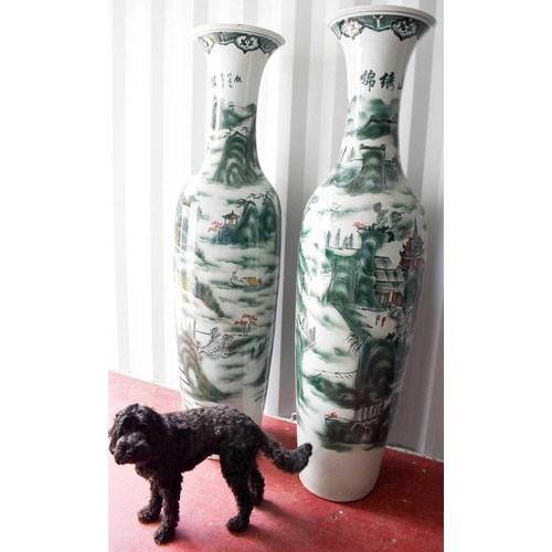 43 - A pair of large Chinese Soldier vases, depicting cranes amidst foliage, standing 2 metres high.