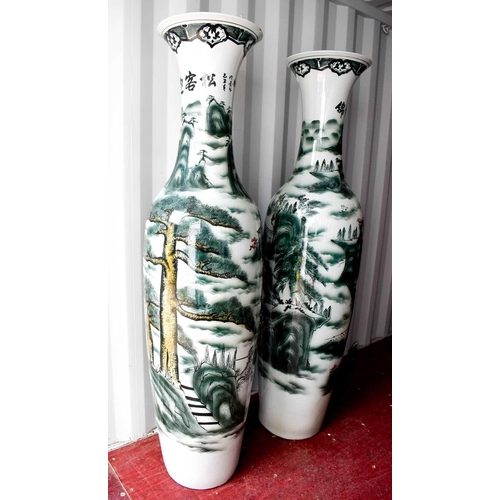 43 - A pair of large Chinese Soldier vases, depicting cranes amidst foliage, standing 2 metres high.