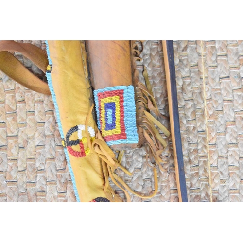 430 - A Sioux Native American beaded leather bow and arrow quiver set, the set includes the quiver, bow an... 