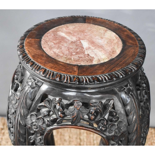 443 - A Chinese late 19th / early 20th century carved hardwood jardiniere stand, with inset marble roundel... 