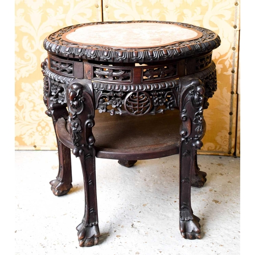 449 - A Chinese hardwood carved jardiniere stand, inset with marble top, raised on five legs, carved and p... 