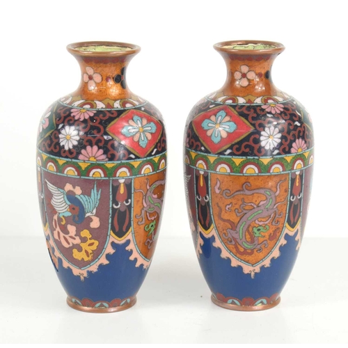 47 - A pair of Chinese cloisonne vases decorated with flowers, bats and dragons, 18.5cm high.