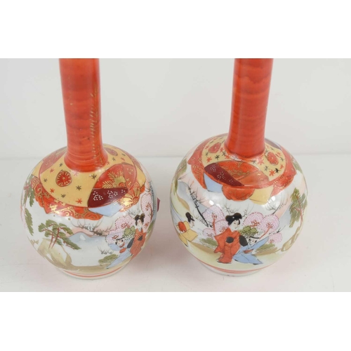 54 - A pair of Japanese Satsuma ware bottle vases, decorated with figures amongst landscapes, with fans a... 