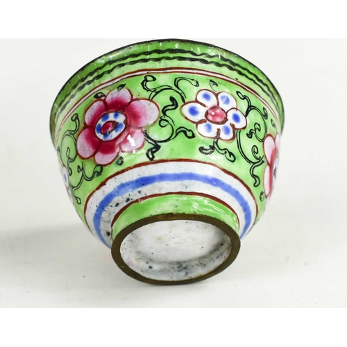 91 - A small Chinese cloisonne bowl, with pink interior, the outside having green ground with flowers, li... 