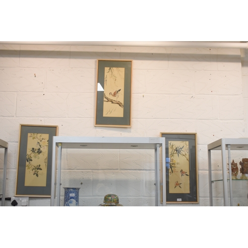 308 - Three Chinese gouache on silk paintings, depicting various birds, signed, each 45 by 17cm.