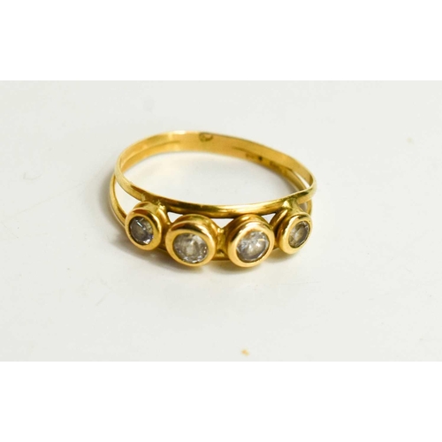 104 - An 18ct gold and paste four stone ring, size O, 2.0g.