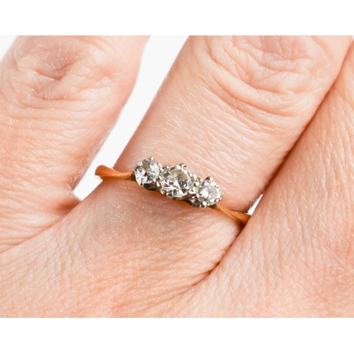 118 - An 18ct gold and diamond three stone ring, the three graduated diamonds brilliant cut, 0.20ct approx... 