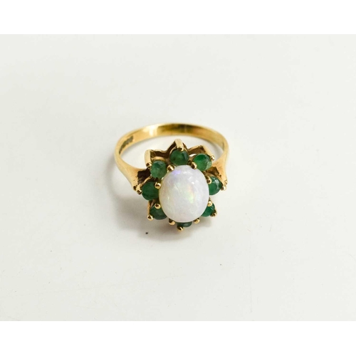 121 - A 9ct gold, opal and emerald ring, in the form of a flowerhead, size P/Q, 3.36g.