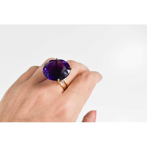 139 - A large and impressive Amethyst dress ring, the single stone of approximately 23.26mm, set in 18ct g... 