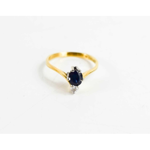 151 - An 18ct gold sapphire and diamond wishbone ring, the oval cut dark sapphire of approximately 4.2 by ... 