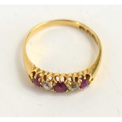 156 - An 18ct gold, ruby and diamond five stone ring set with three rubies, two diamonds, size N, 2.6g.