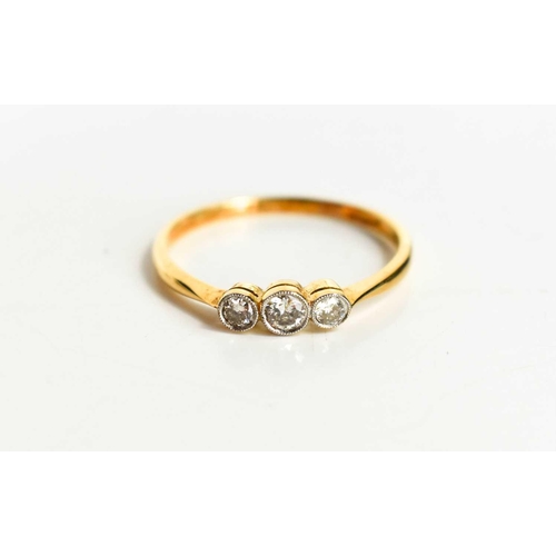 164 - An 18ct gold and diamond three stone ring, the central diamond of approximately 3.2mm diameter, 0.12... 