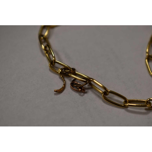 168 - An 18ct gold bracelet composed of elongated oval links, and having a heart charm, 11.46g. The piece ... 