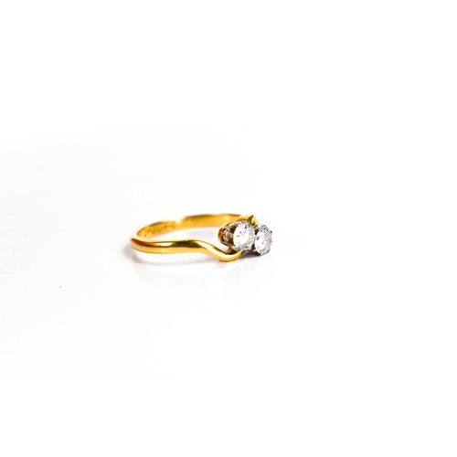 170 - An 18ct gold and diamond crossover ring, each diamond of approximately 3.9mm diameter, 0.25ct each, ... 