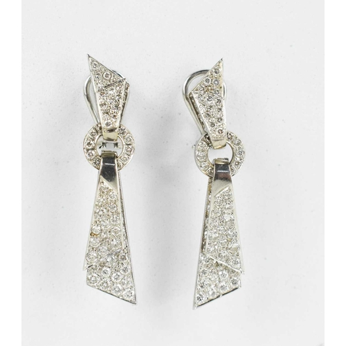 171 - A pair of 18ct white gold and diamond encrusted modernist design drop earrings, the folded ribbon ef... 