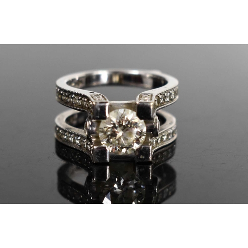 184 - A 14ct white gold and diamond dress ring, set with central stone of approximately 1.5ct, 7.4mm diame... 