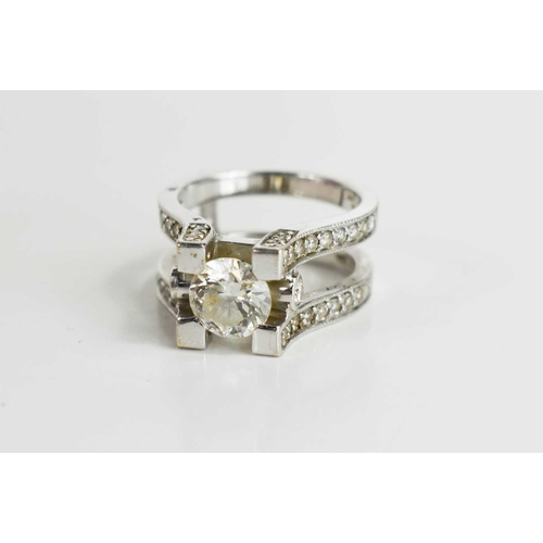 184 - A 14ct white gold and diamond dress ring, set with central stone of approximately 1.5ct, 7.4mm diame... 