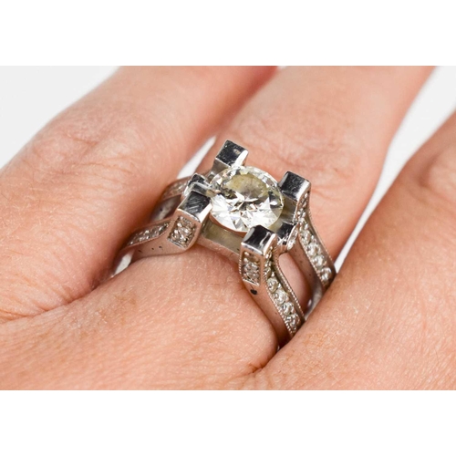 184 - A 14ct white gold and diamond dress ring, set with central stone of approximately 1.5ct, 7.4mm diame... 