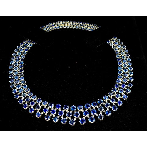 187 - A stunning 18ct white gold, sapphire, and diamond résille collar necklace by Pragnell, showcasing 89... 