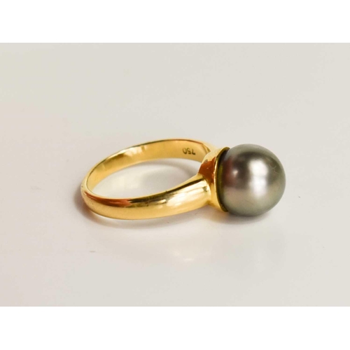 19 - An 18ct gold and pearl dress ring, the grey pearl of approximately 9.4mm, size L, 4.75g.