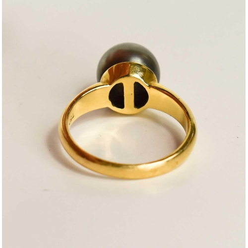 19 - An 18ct gold and pearl dress ring, the grey pearl of approximately 9.4mm, size L, 4.75g.