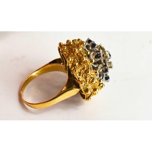 20 - A gold, diamond and sapphire cluster ring, unmarked but testing as 18ct gold, the four brilliant cut... 