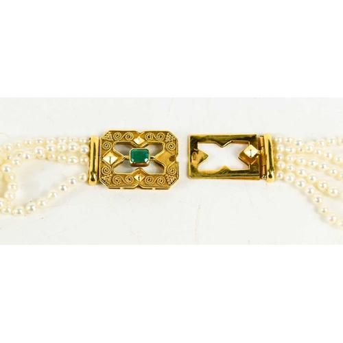 21 - A five strand seed pearl choker with 18ct gold and emerald set clasp in the Byzantine style and four... 