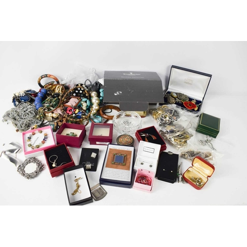 228 - A collection of costume jewellery to include beaded necklaces, bangles, silver filigree brooch, marc... 