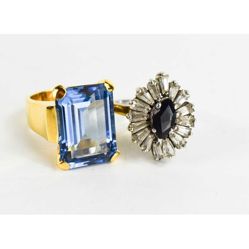 242 - A silver, sapphire and paste 20th century modernist ring, the dark marquise cut sapphire of approxim... 