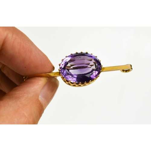 247 - A gold plated and amethyst brooch, the oval cut amethyst 17 by 12mm, 5.74g in total, together with a... 