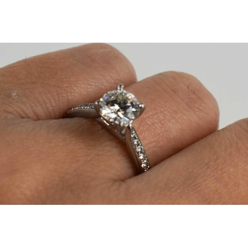 27 - A solitaire diamond and 950 platinum ring, the brilliant cut solitaire of approximately just over 1c... 