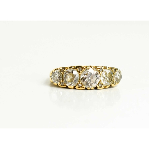 28 - A gold and diamond five stone ring, the old cut diamonds graduated, with the central diamond approxi... 