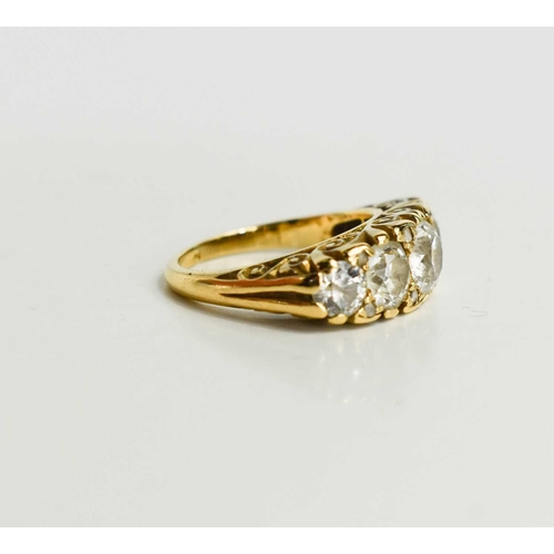 28 - A gold and diamond five stone ring, the old cut diamonds graduated, with the central diamond approxi... 