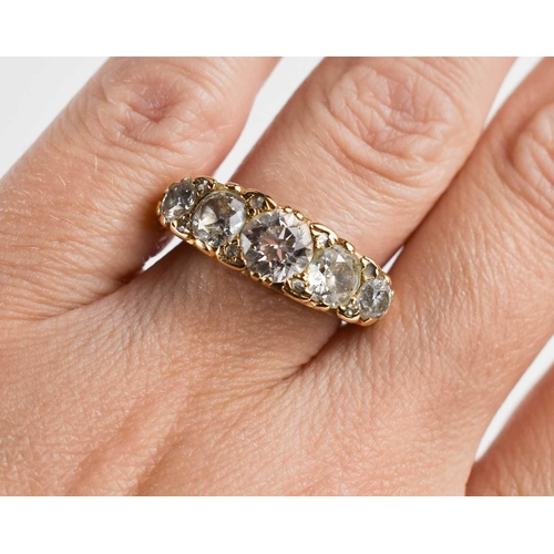 28 - A gold and diamond five stone ring, the old cut diamonds graduated, with the central diamond approxi... 