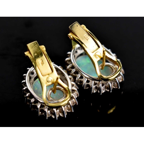 3 - A pair of 18ct gold, opal and diamond earrings, the oval opals of approximately 14 by 9.9 by 2.1mm, ... 