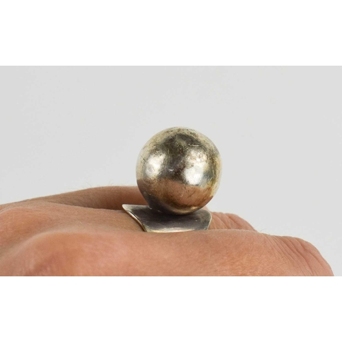 30 - A Carl Ove Frydensberg silver dress ring, the flared band set with a single silver ball, marked COF ... 