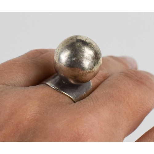 30 - A Carl Ove Frydensberg silver dress ring, the flared band set with a single silver ball, marked COF ... 