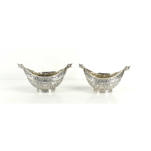 314 - A pair of unusual 19th century Indian white metal (likely silver) boat shaped Bon Bon dishes, ellipt... 