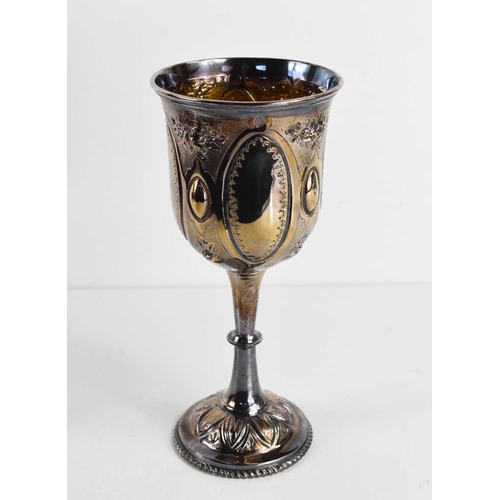 317 - A Victorian silver chalice, with gilded interior, and embossed with decoration, Sheffield 1877, 4.73... 