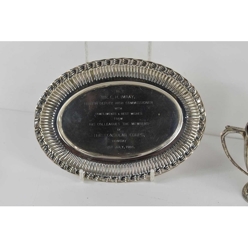 318 - A group of silver comprising of two silver presentation trays engraved to Colin Imray from colleague... 