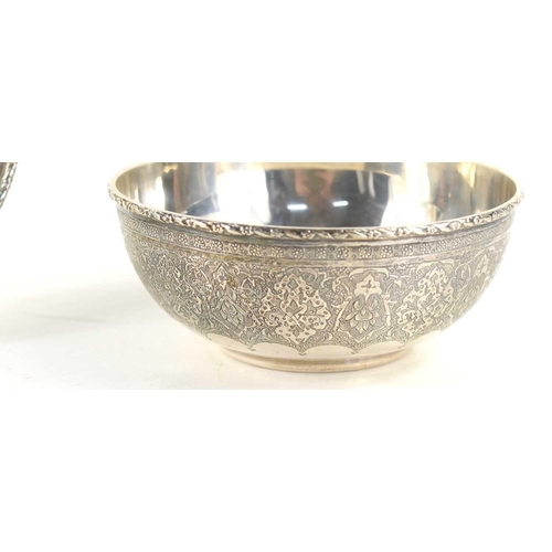 321 - A 20th century Iranian silver bowl and dish engraved with foliate decoration and repeating geometric... 