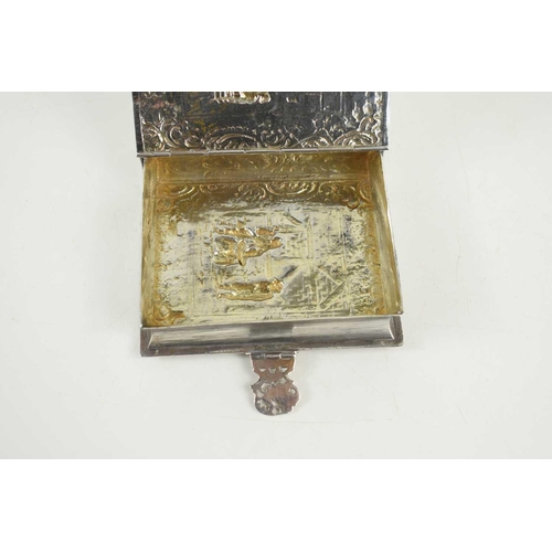 324 - An early 20th century Dutch silver tobacco box of book form with clasp, the box embossed with foliat... 