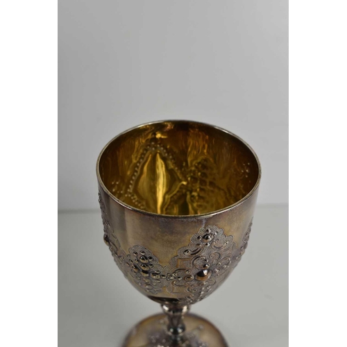 326 - A silver chalice, with gilded interior, and embossed with vacant cartouches, with knop stem, indisti... 