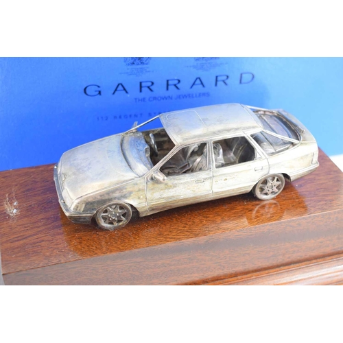 353 - A silver Ford Scorpio by Garrard & Co, presented to Coxes Motors of Leicester by Ford for selling th... 