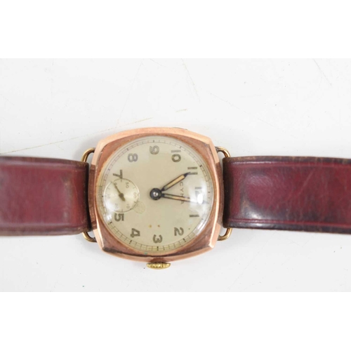 362 - A Rose gold cased Cyma wristwatch with brown leather strap and arabic dial.